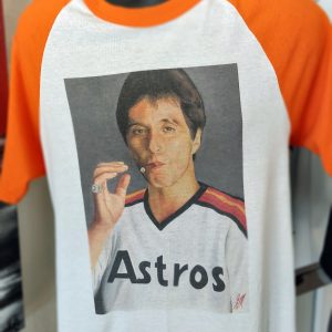 Scarface in a Astros jersey on a Ragland Shirt With Orange Sleeves