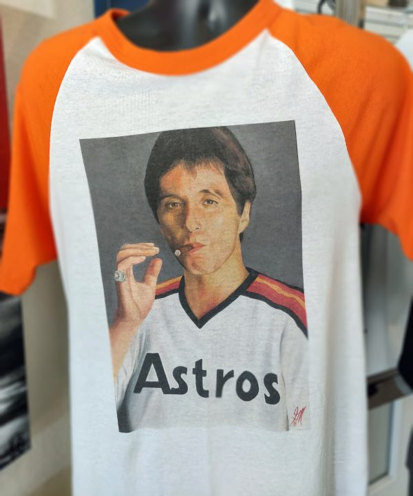 Scarface in a Astros jersey on a Ragland Shirt With Orange Sleeves